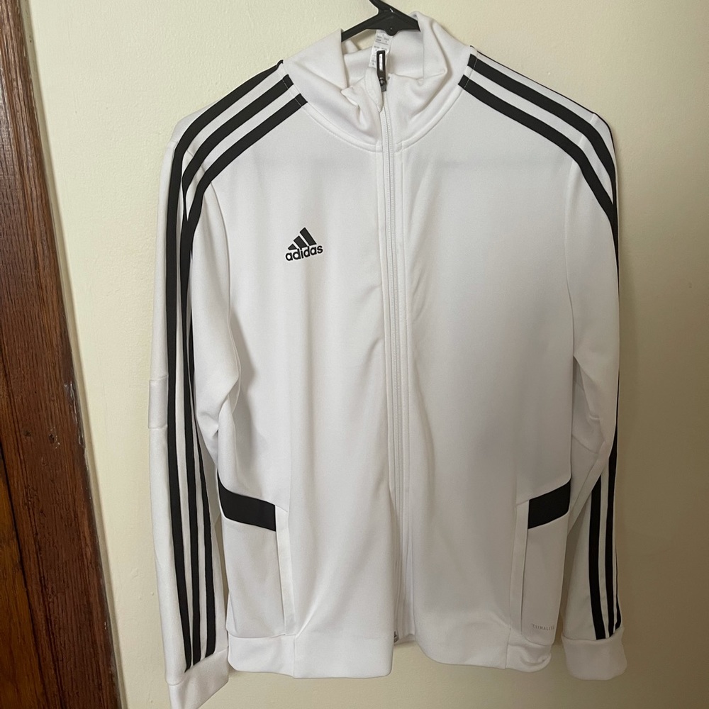 Women’s white adidas track jacket.